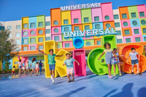 Kids enjoy the entrances "Kids" sign at Universal Kids Resort.