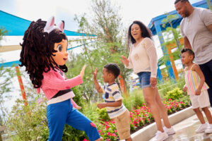 Kids and their families high-five Gabby from DreamWorks’ Gabby’s Dollhouse