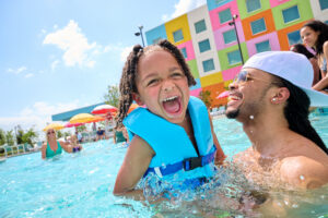 Guests enjoy the pool at Universal Kids Resort Hotel