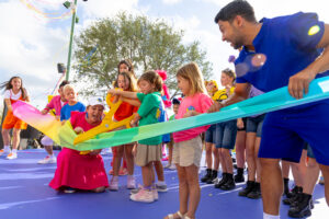Universal Kids Resort celebrated its grand opening with a colorful ribbon cutting with an oversized pair of children's scissors. 